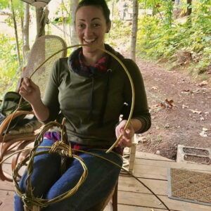 apprentice cate weaving a willow basket