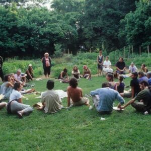 Group of people sitting in a circle forming an intentional community