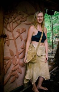 woman wearing a buckskin skirt and possibles bag