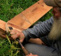 closeup of building instructor using chisel