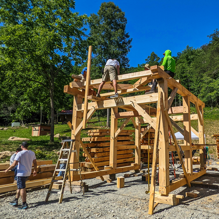 students building a mortise and tenon structure at a Wild Abundance Timber Framing Workshop