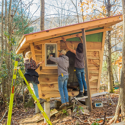 Students learning to build a DIY structure during a 4 month carpentry and building program that meats 2 days a week at Wild Abundance in North Carolina