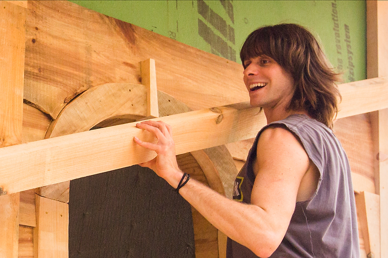 Student in the 4 month carpentry and building program working on a DIY building project on the campus of Wild Abundance Carpentry and building school in North Carolina