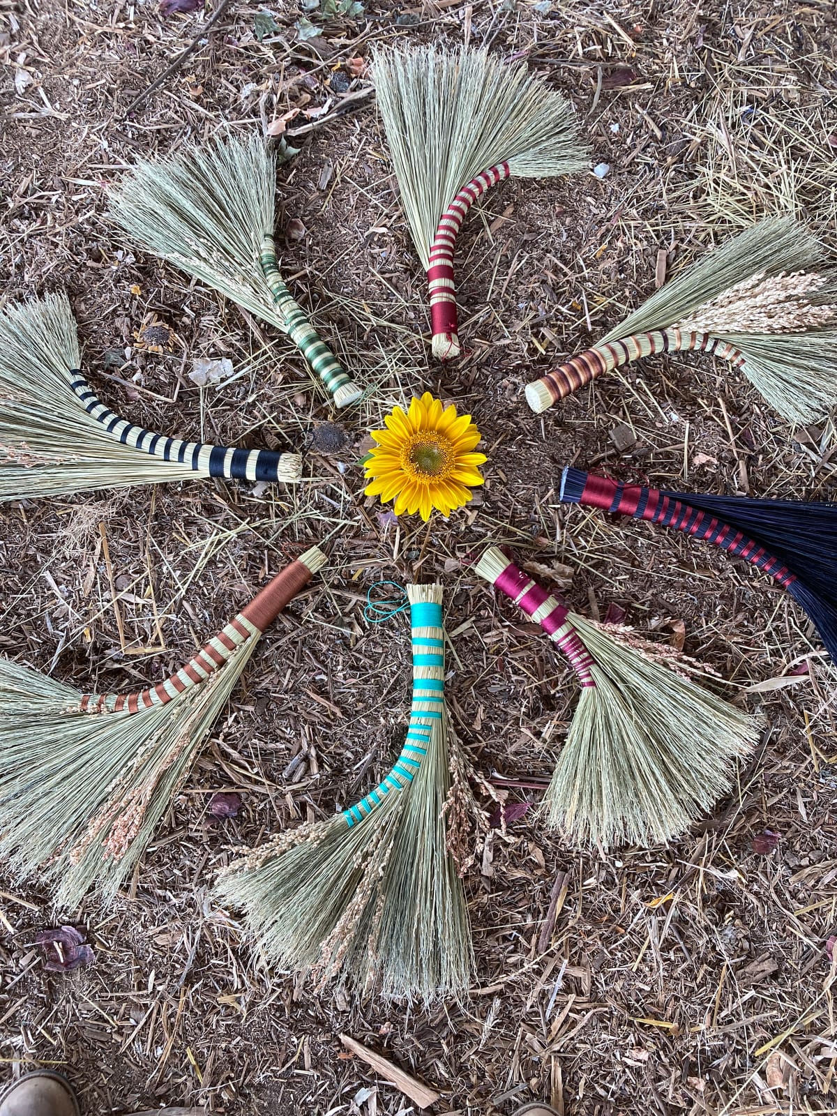 Handmade brooms created by students under guidance from Emileigh Zola at the 4 day Women's Rewilding Retreat at Wild Abundance, a healing getaway that focusing on handcrafted traditional skills and wisdom through nature immersion