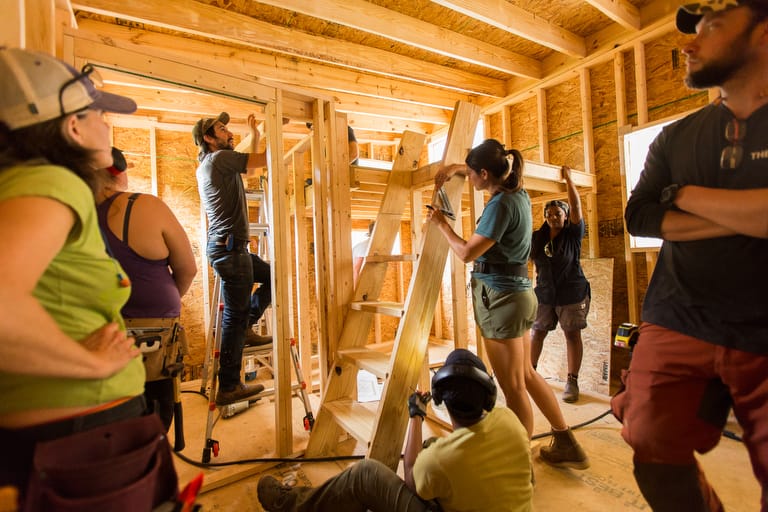 Students in a carpentry class learn to build a Tiny House 